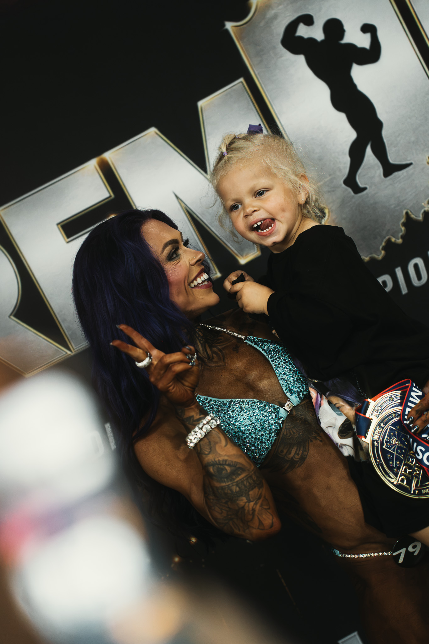 Champion and child after the competition