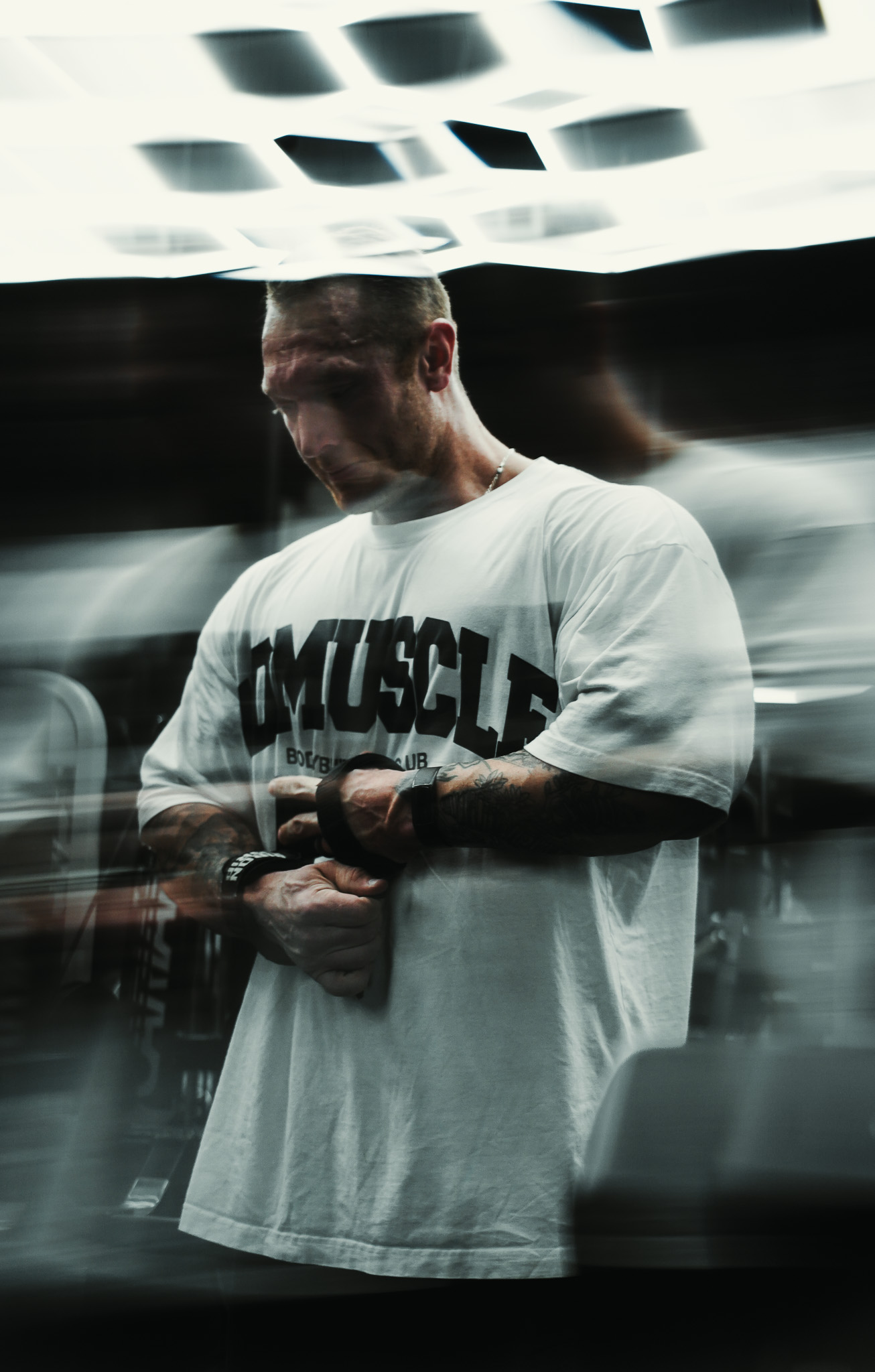 Athlete preparing wrist straps with motion blur