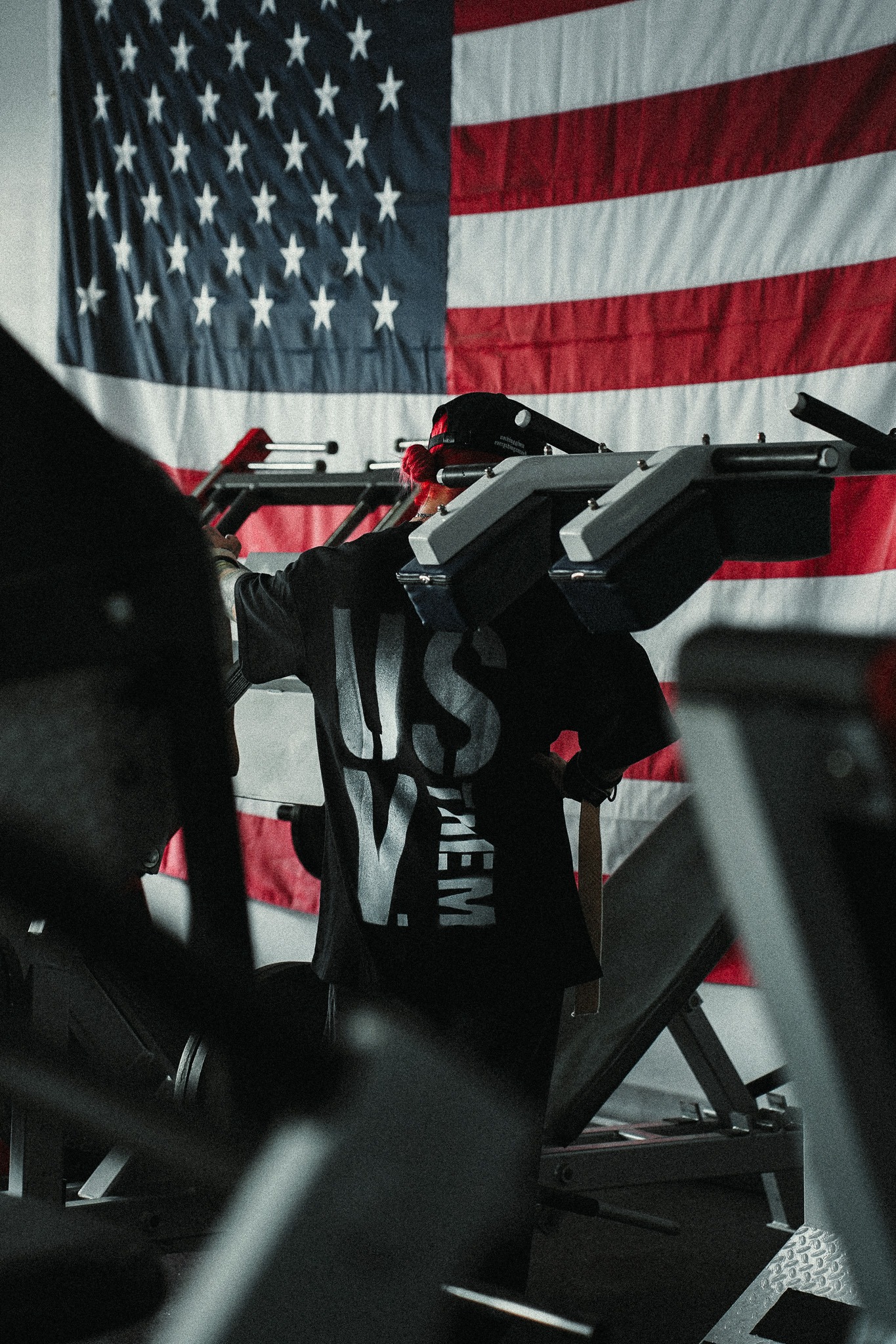 Athlete training in front of an American flag