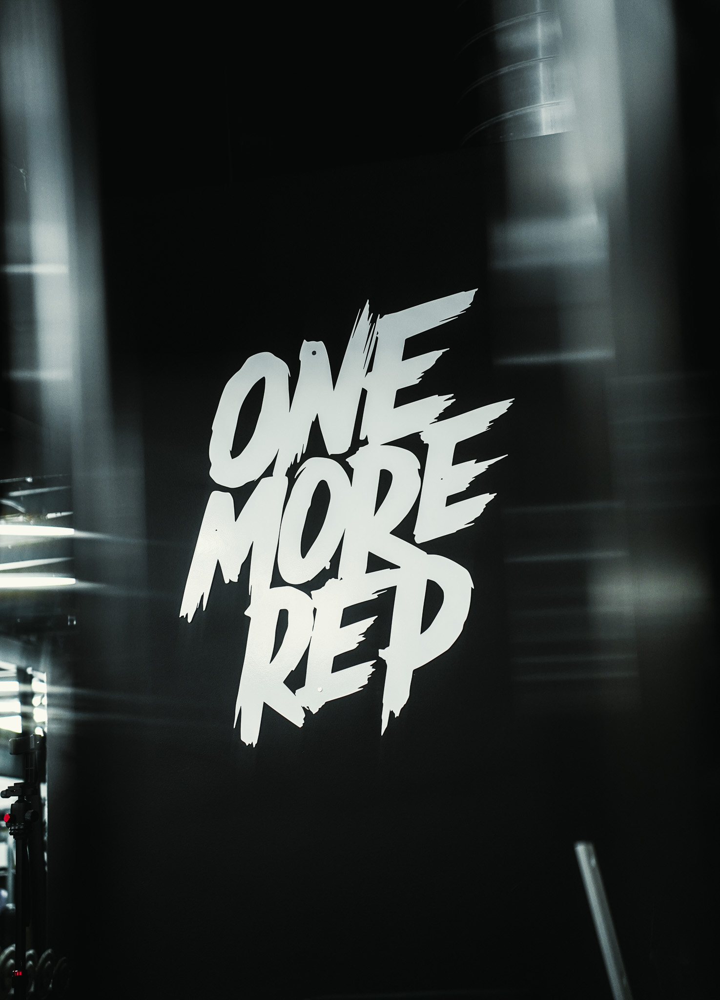 One More Rep gym wall branding