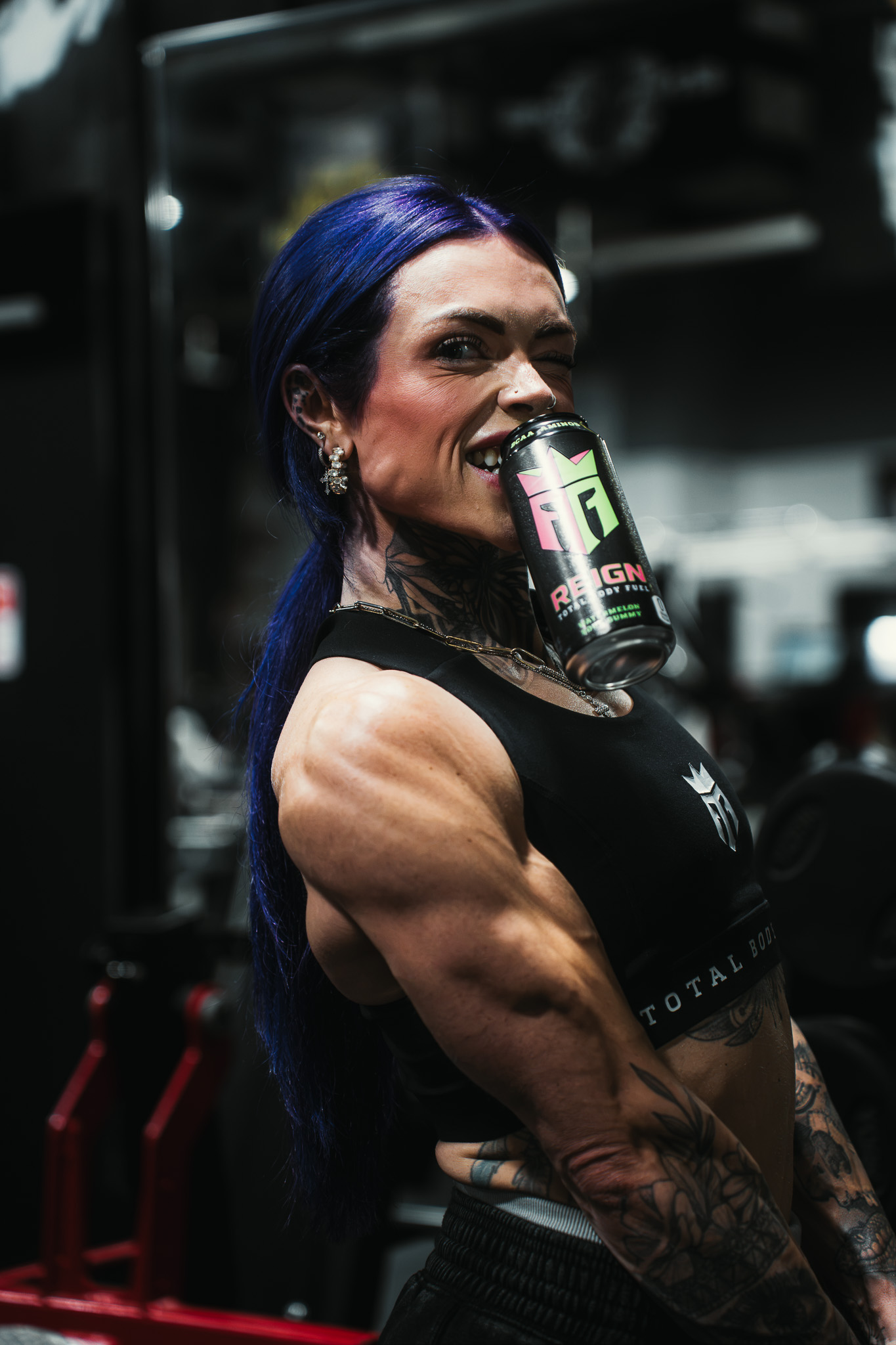 Reign athlete with a Reign energy drink